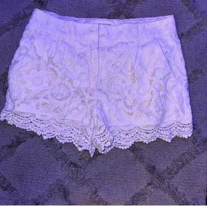 White floral jean shorts. They are a L.